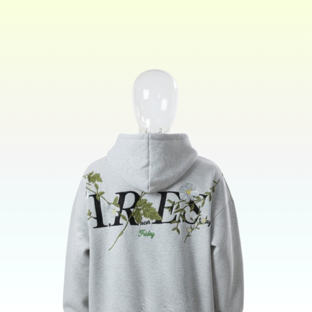 Gray hoodie with floral and text design on a white background