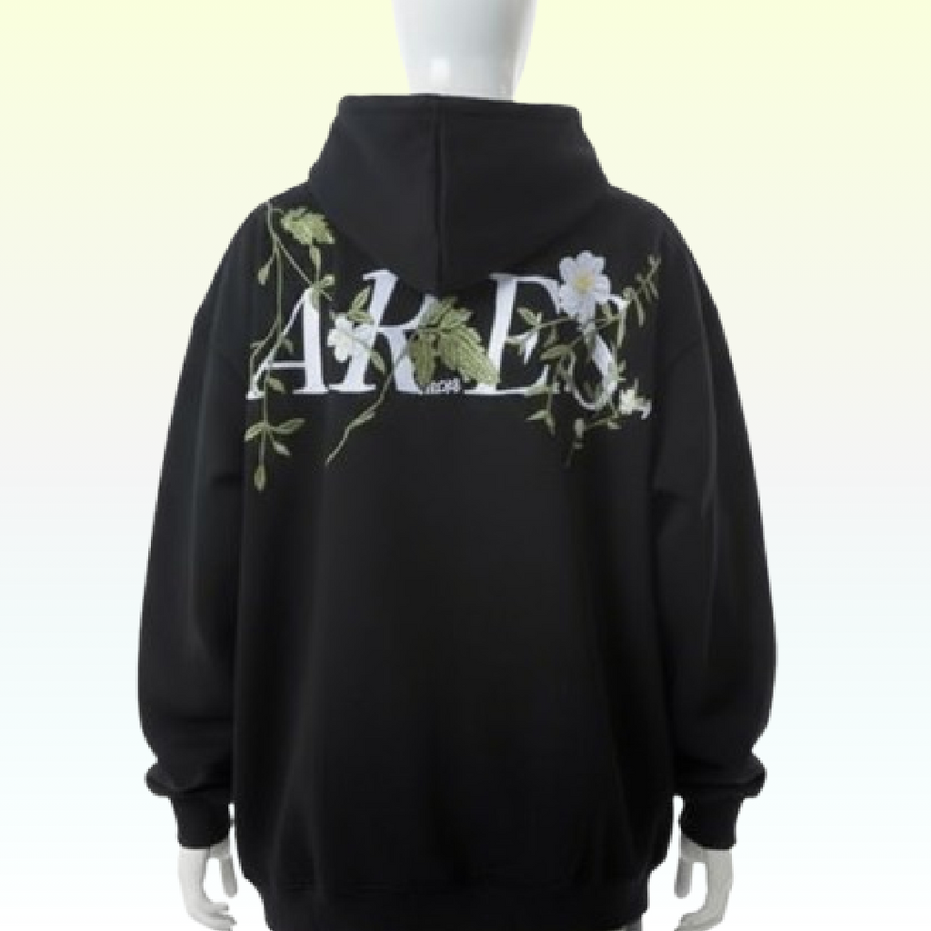 Black hoodie with floral designs and text on a white background